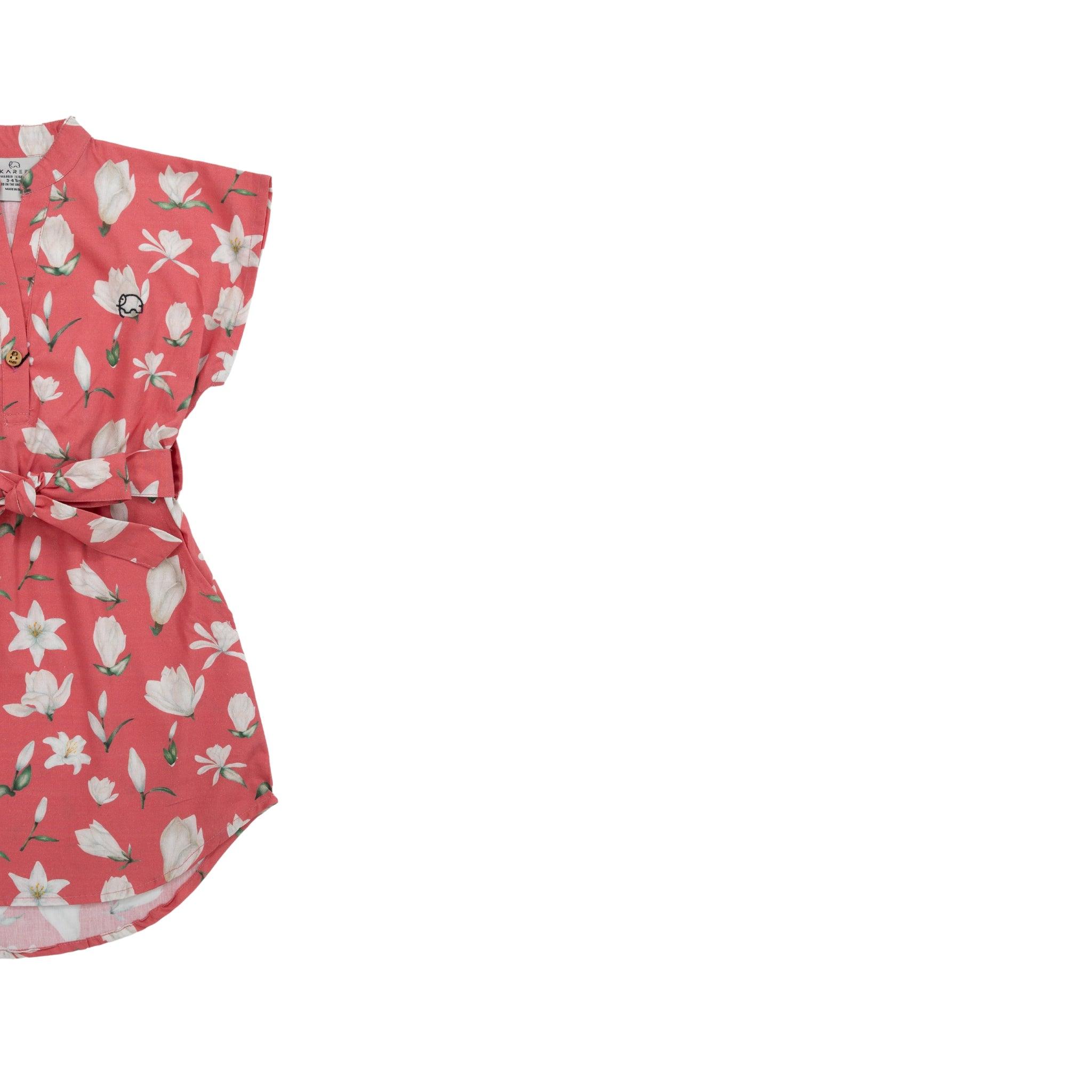 Red floral print dress with a belt, displayed flat against a white background, is transformed into a Karee Mineral Red Lilly Blossom Cotton Shirt Dress.